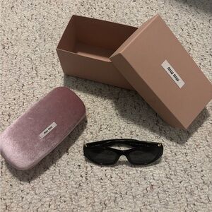 Miu Miu Black and Gold Sunglasses